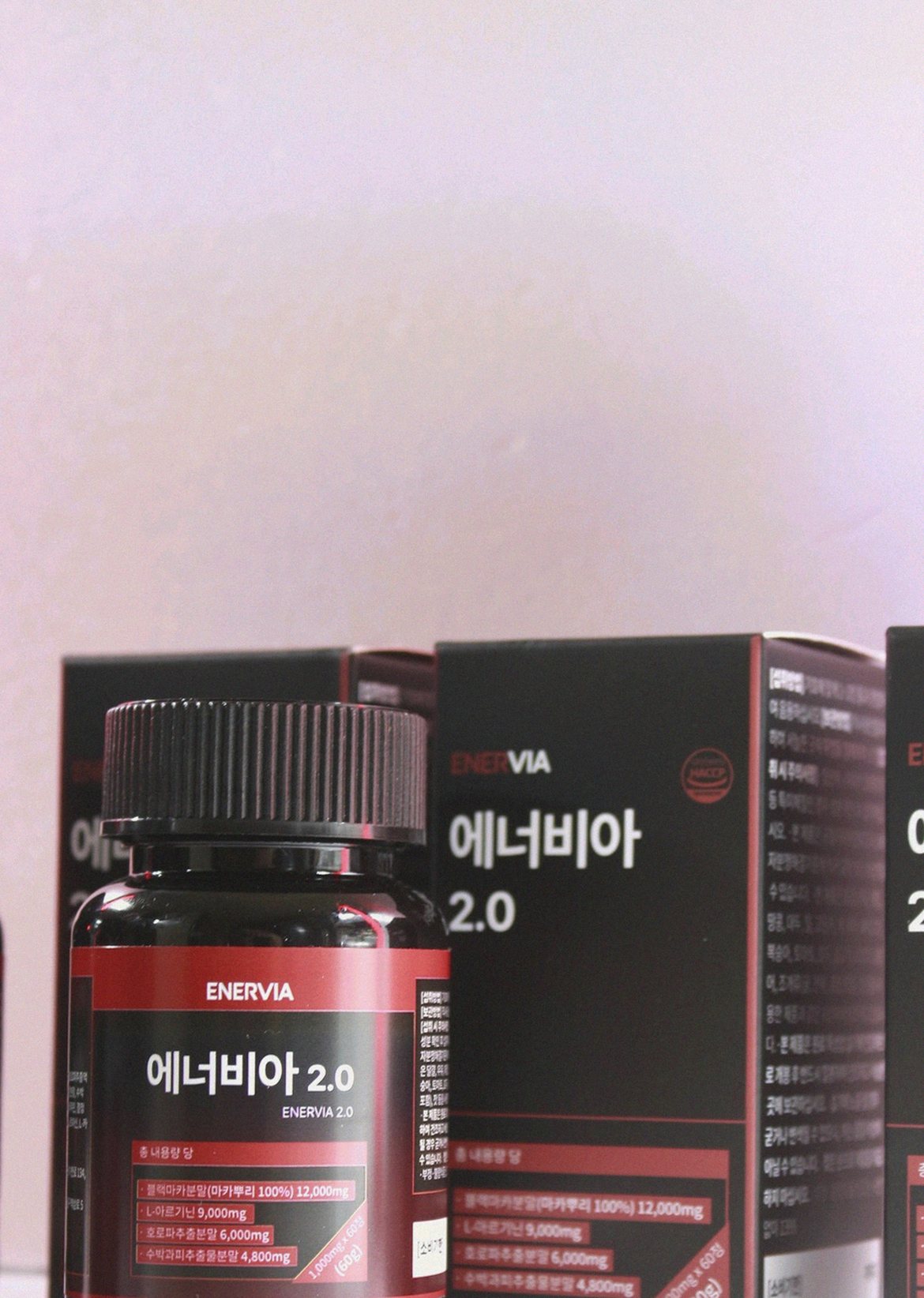 Korean Asian man in 30s taking supplement with water at home evening