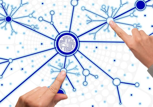 The fingers of both hands are pointing at two important points in the network that are spreading like snow crystals are spreading.