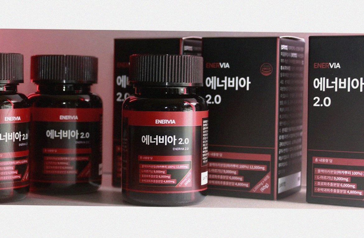 Korean Asian man in 50s taking supplement with water morning routine