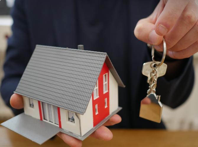 miniature house with a key