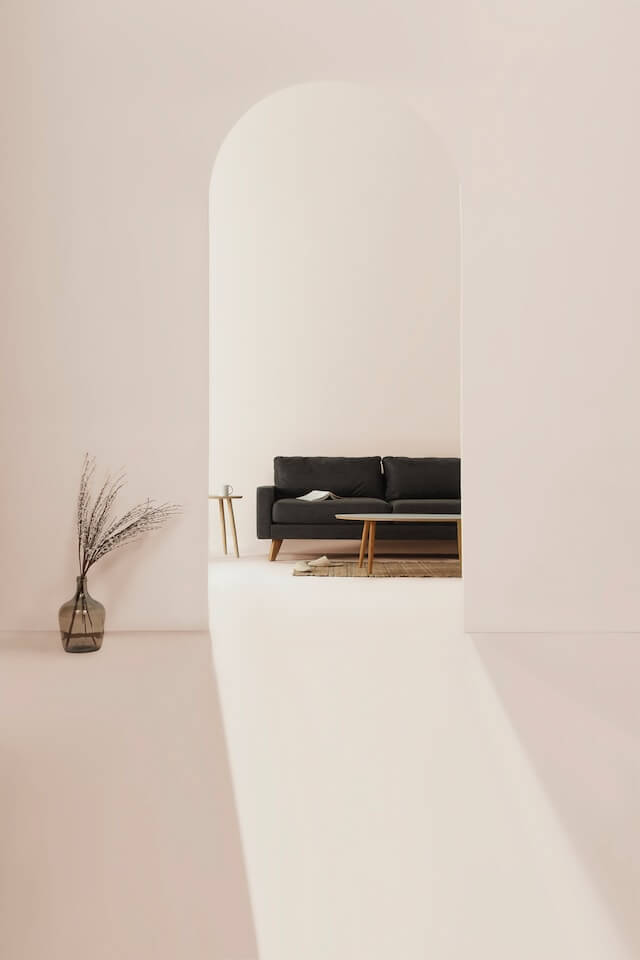 Image of a room with some furniture and a vase.