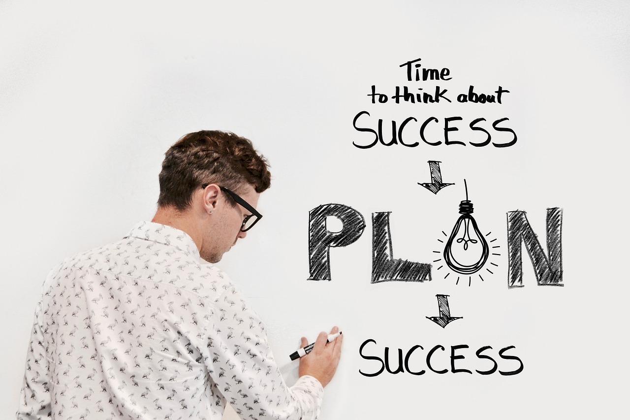 A man writing about plan