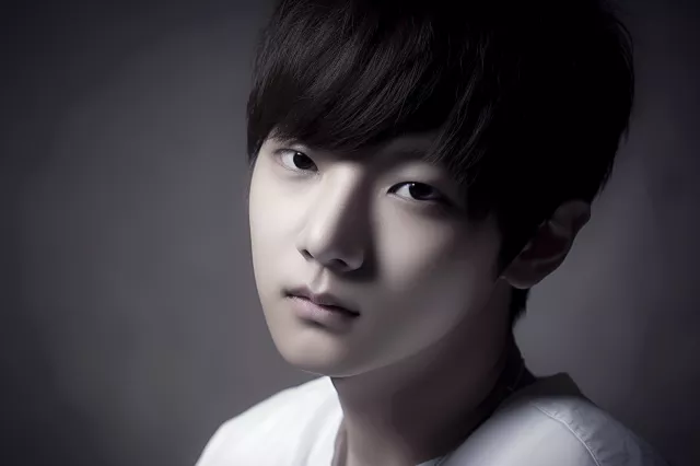 hyper realistic photograph from Vogue::1 a k-pop boy::5 luxury bright brown colored hair&amp;#44; Hershey cut hair::1 white shirt::1 studio lighting::1 natural lighting::1 --ar 3:2