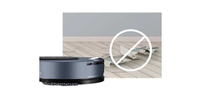 로봇 청소기(CordZero ThinQ)가 깨진 접시 파편(위험 물체) 근처에 있으며, 깨진 파편 위에 **금지 표시(큰 X자 원)**가 겹쳐져 있는 모습. (로봇 청소기가 위험 물체를 감지하고 피하는 기능을 시사하는 이미지)