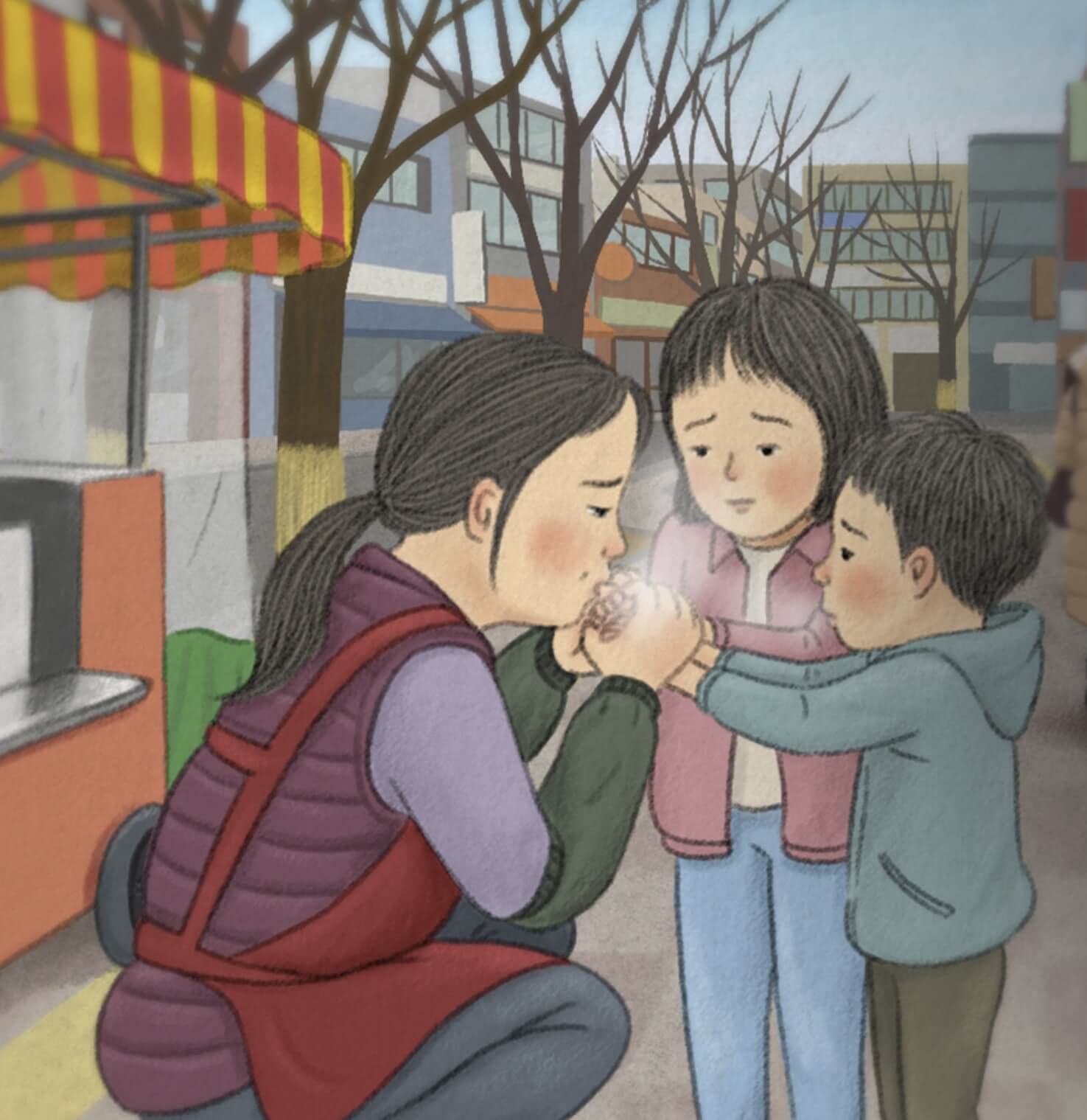 추운 아이들 손에 입김을 불어주는 엄마