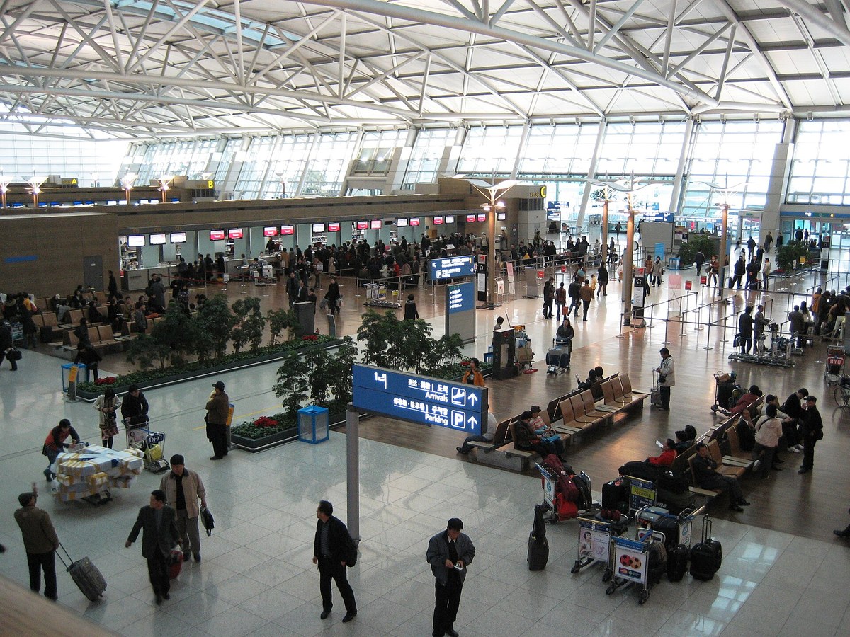 Departure hall inside Incheon Airport Terminal 1 with check-in counters