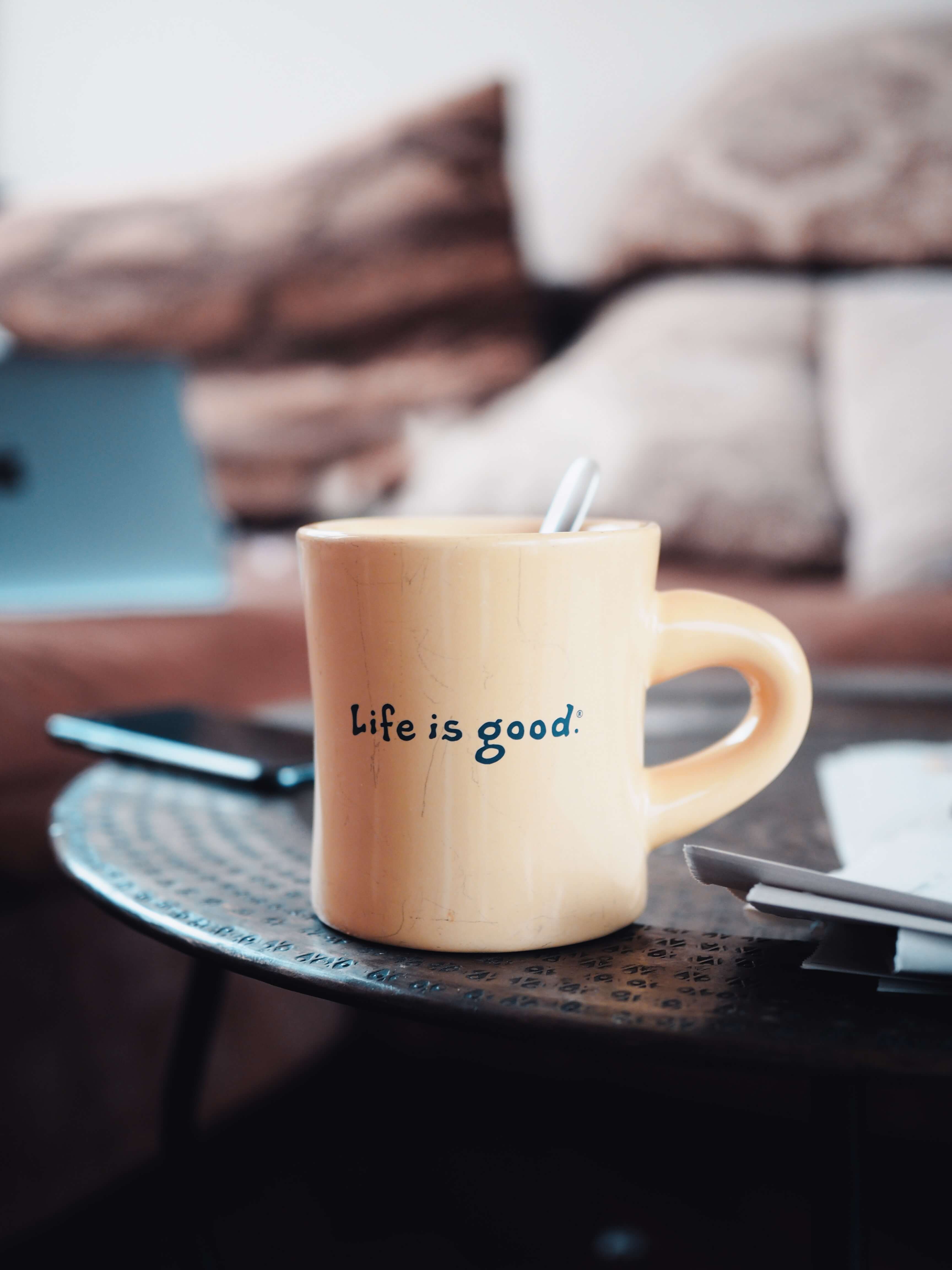 A picture of a mug cup with a printed sentence of "Life is good"