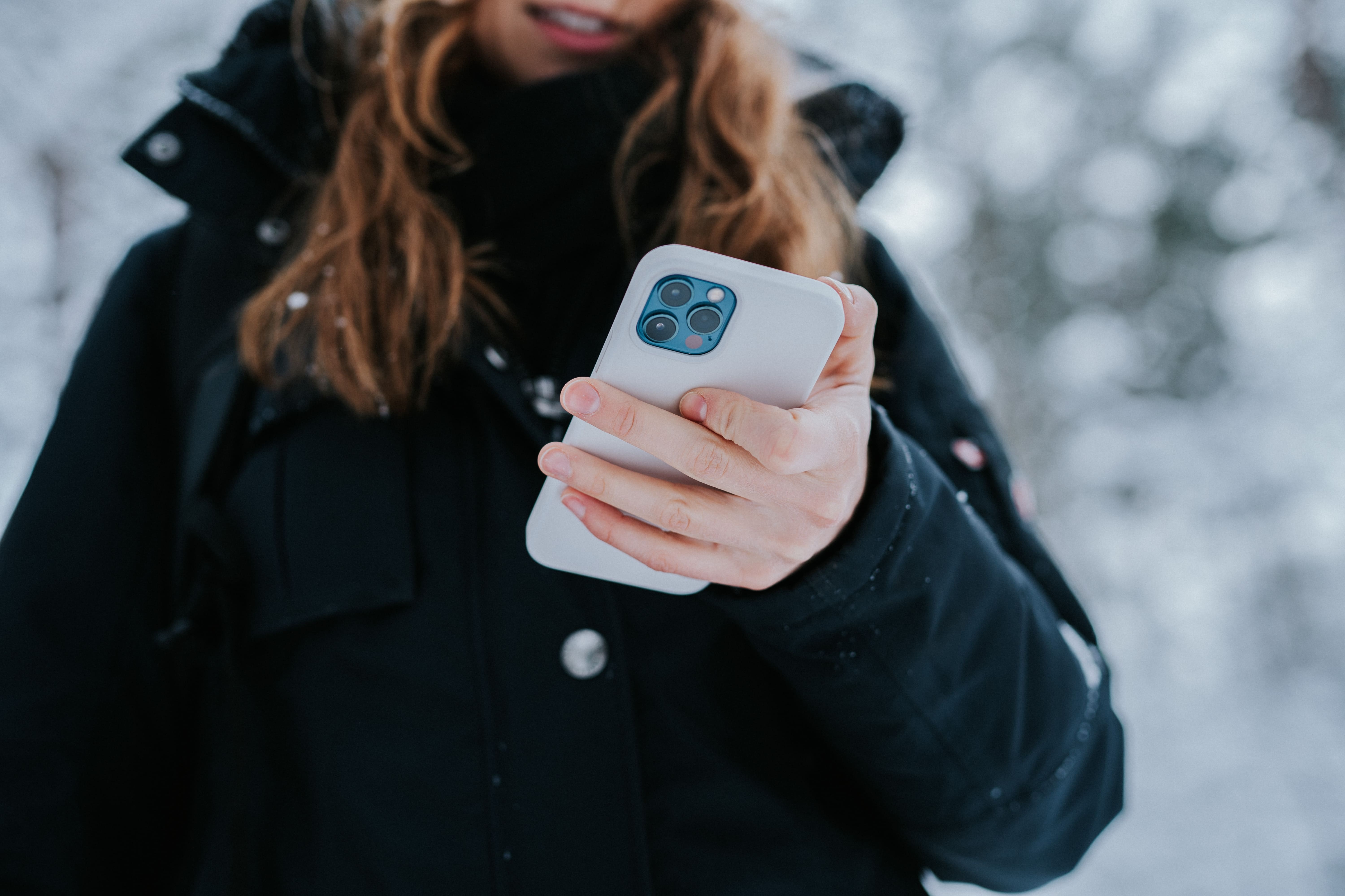Woman controlling a smartphone