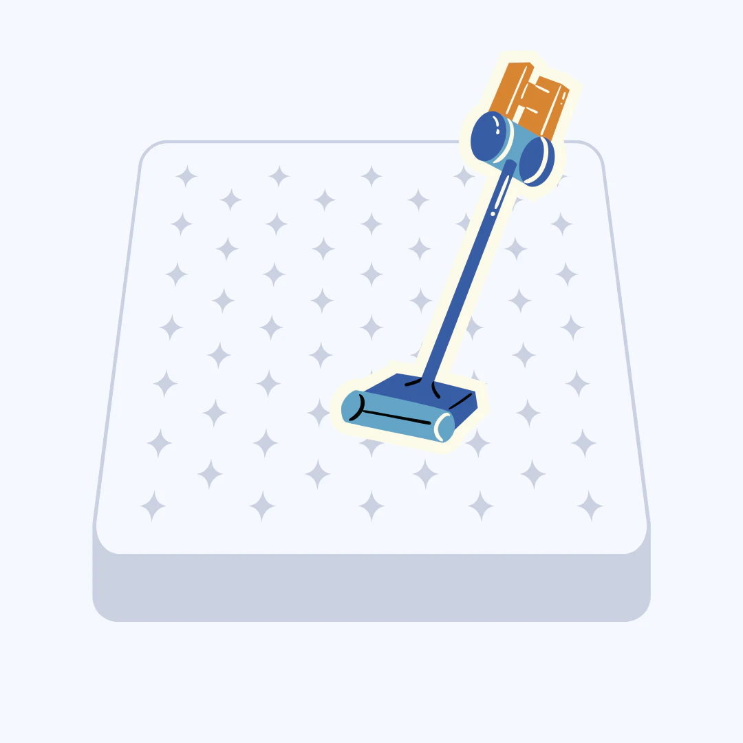 청소기로 매트리스 먼지를 제거하는 모습