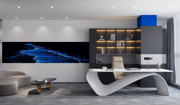사무실 풍경으로 하얀 책상이 있고, 파란색 물길이 그려진 기다란 액자가 벽에 있다.