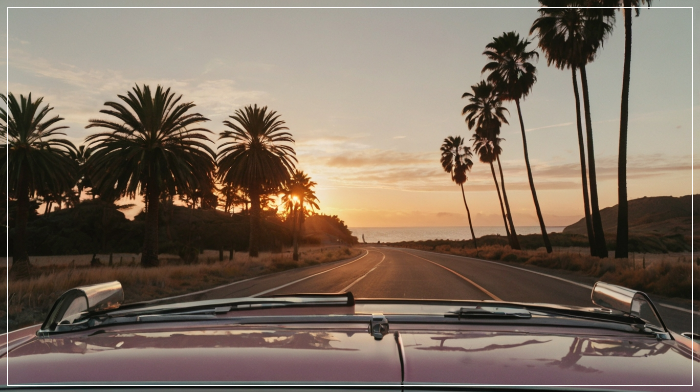 pink convertible driving westcoast