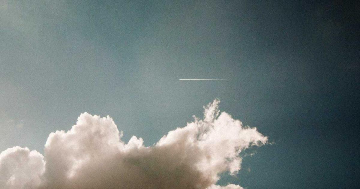 person using smartphone with stock app