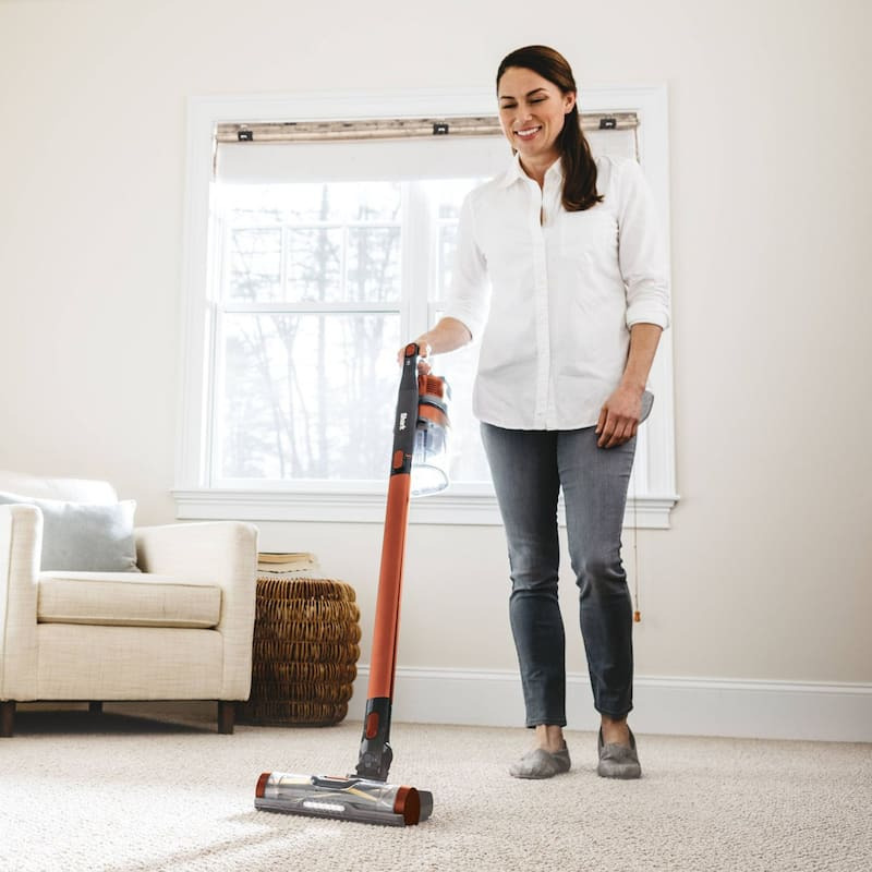 Modern living room with cordless vacuum cleaner