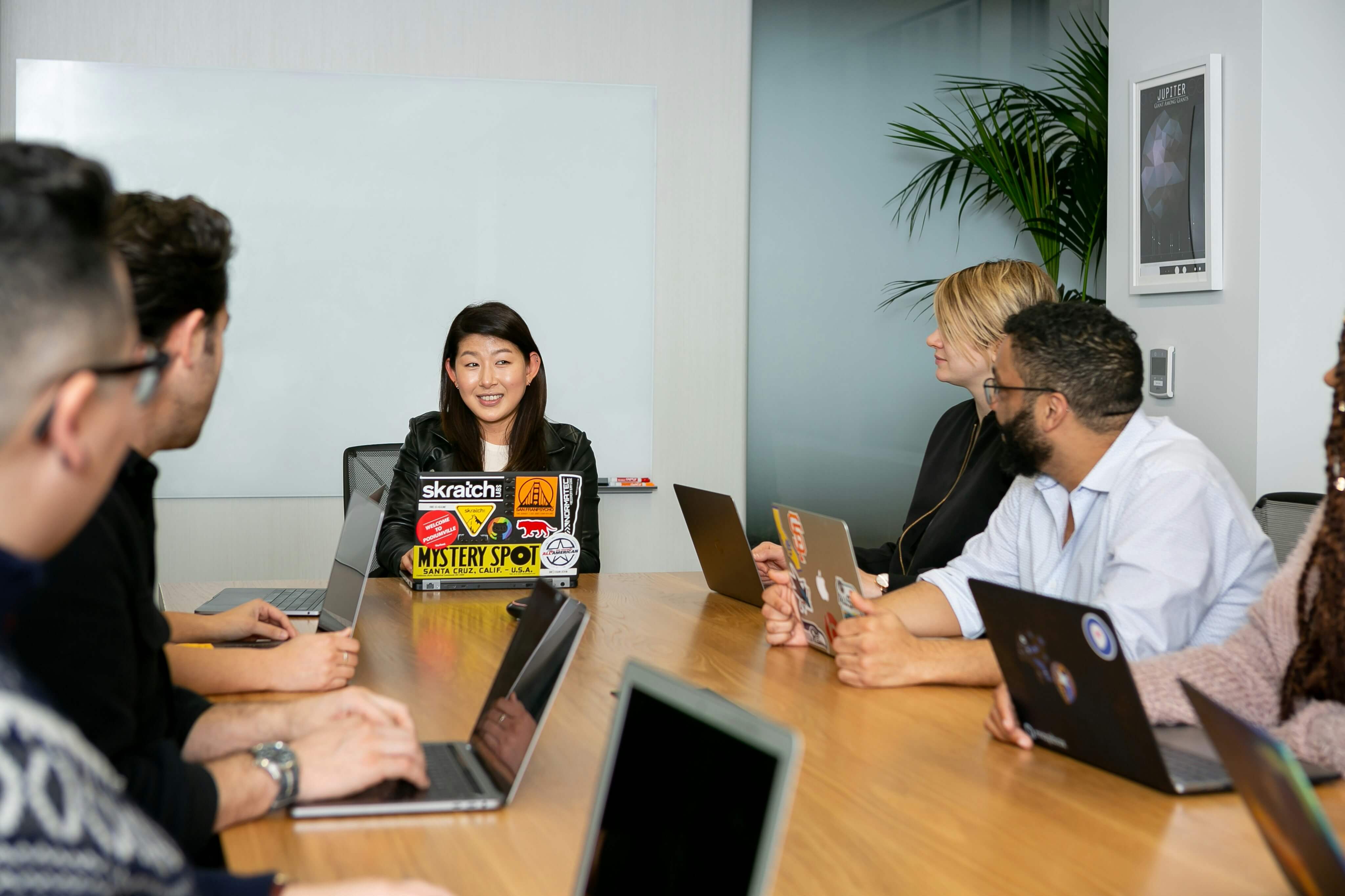 A young boss working together with employees