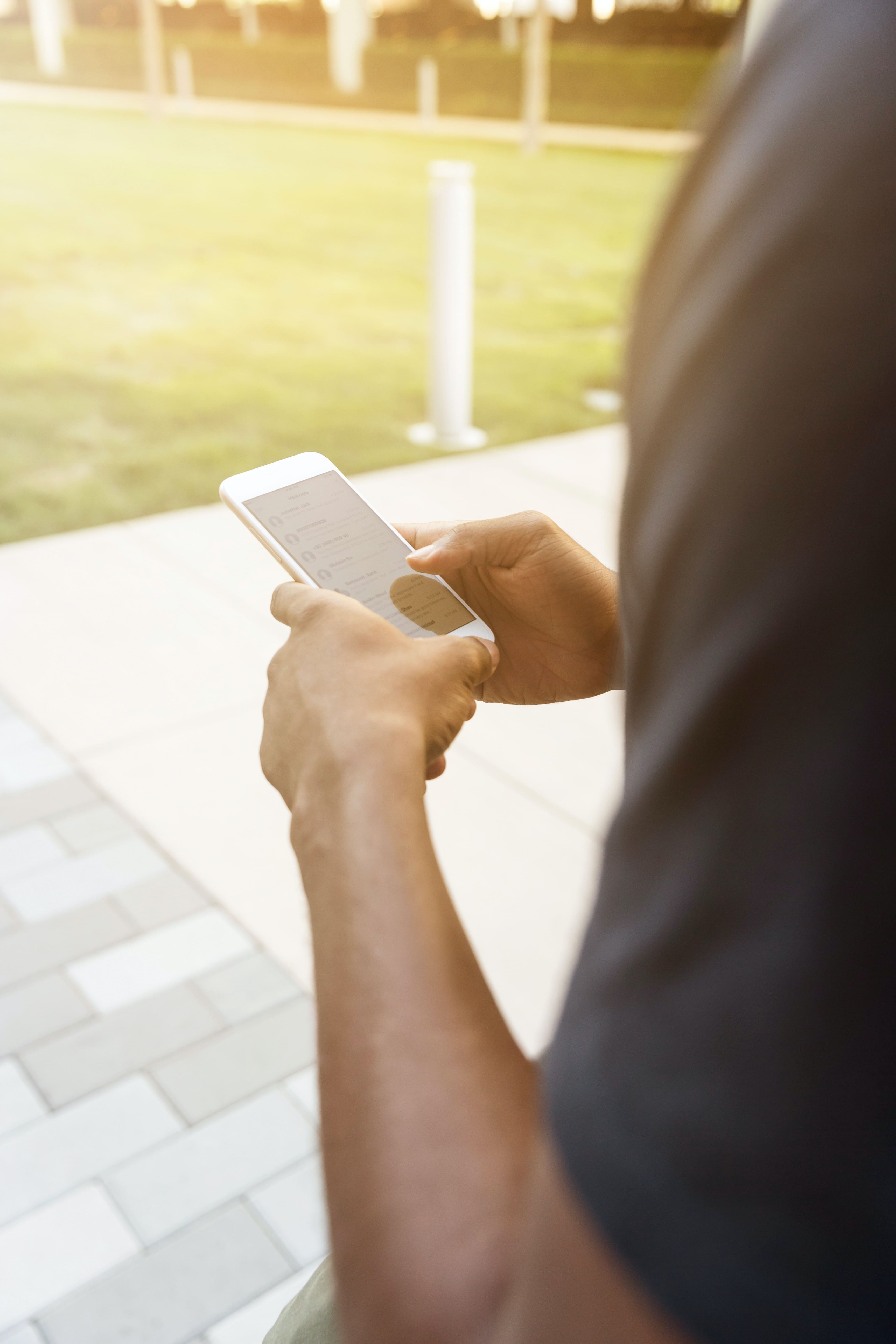 Man writing on keyboard on mobile phone