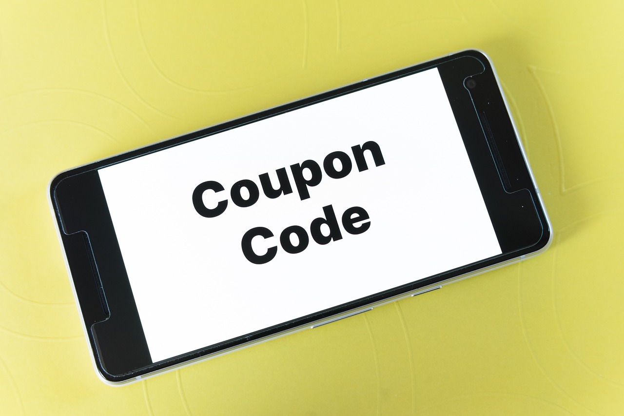 Smartphone screen displaying a coupon code on a white background