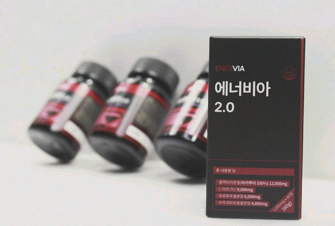 Korean Asian man 35 taking supplement after dinner at home