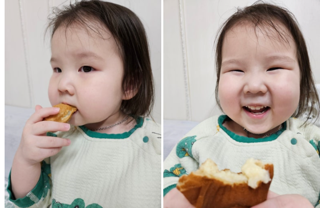 아이가 붕어빵을 먹고 웃는 모습