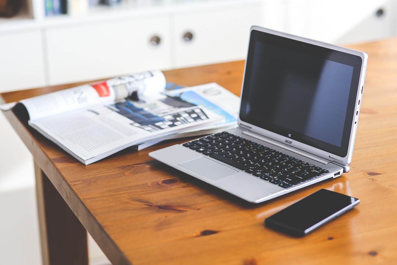 A laptop and a cellphone on the table