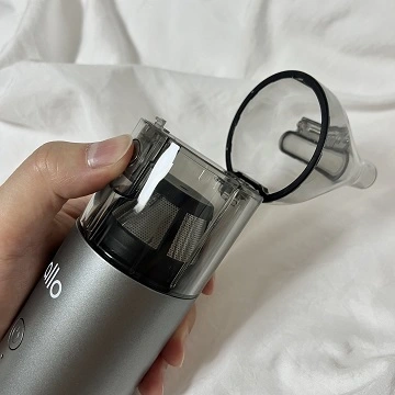 상단부 동그란 버튼을 누르면 열리는 먼지통