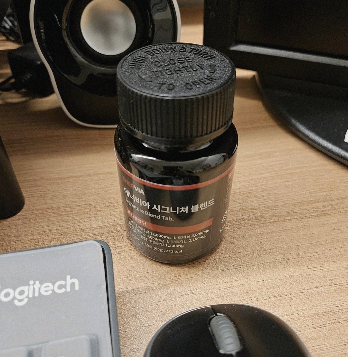 Korean Asian man in 40s taking supplement before morning workout