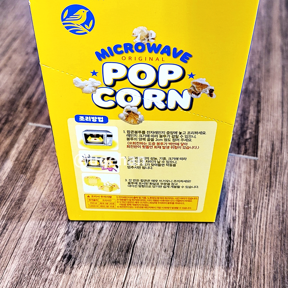 노브랜드 전자레인지용 팝콘 제품조리법이 쓰여있다.