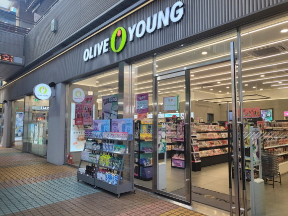 Olive Young store exterior in South Korea, a popular beauty and skincare retailer known for sales events and Korean cosmetics.
