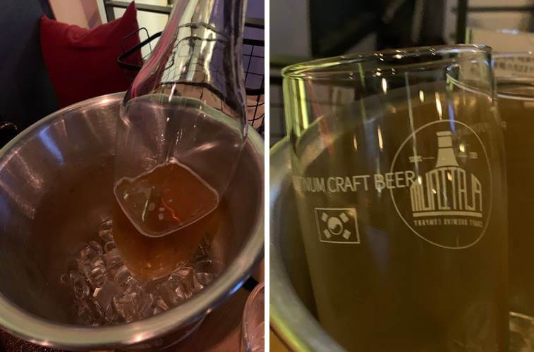 양동이 통에 가득 담겨진 얼음과 수제맥주