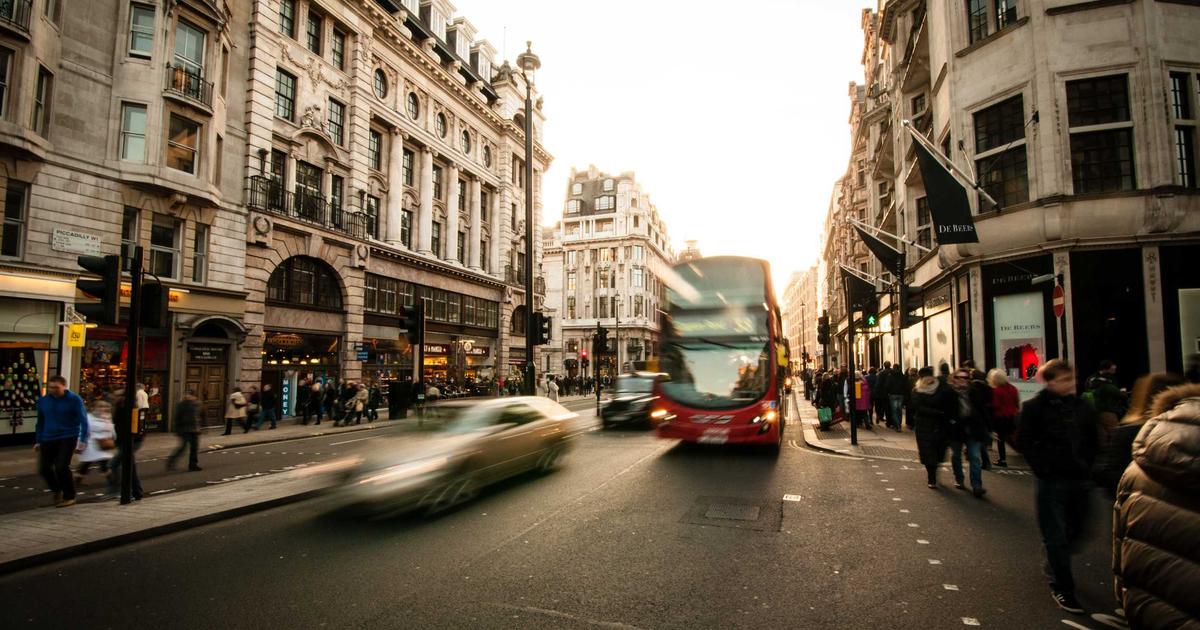 person creating AI art on a tablet, vivid digital painting flying out