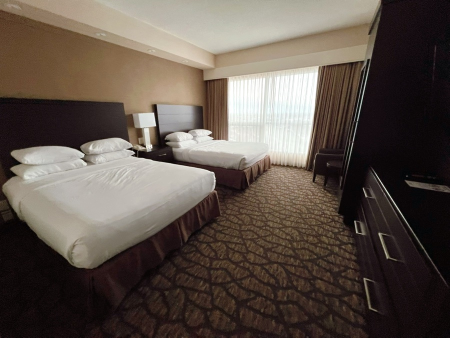 Main bedroom inside Embassy Suites Niagara Falls suite with direct waterfall view