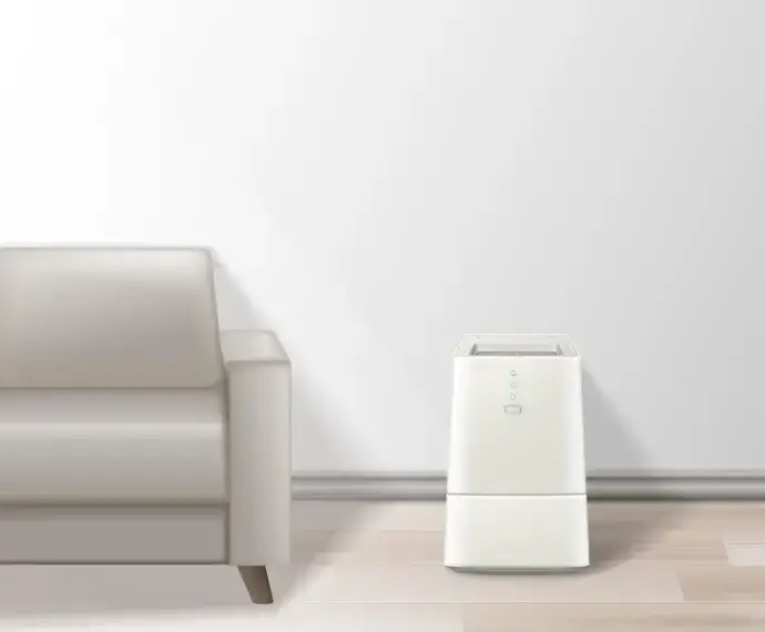 거실 소파 옆에 효율적으로 배치된 제습기 모습으로, 제습기 효율적 사용법을 시각적으로 표현한 실내 인테리어 이미지