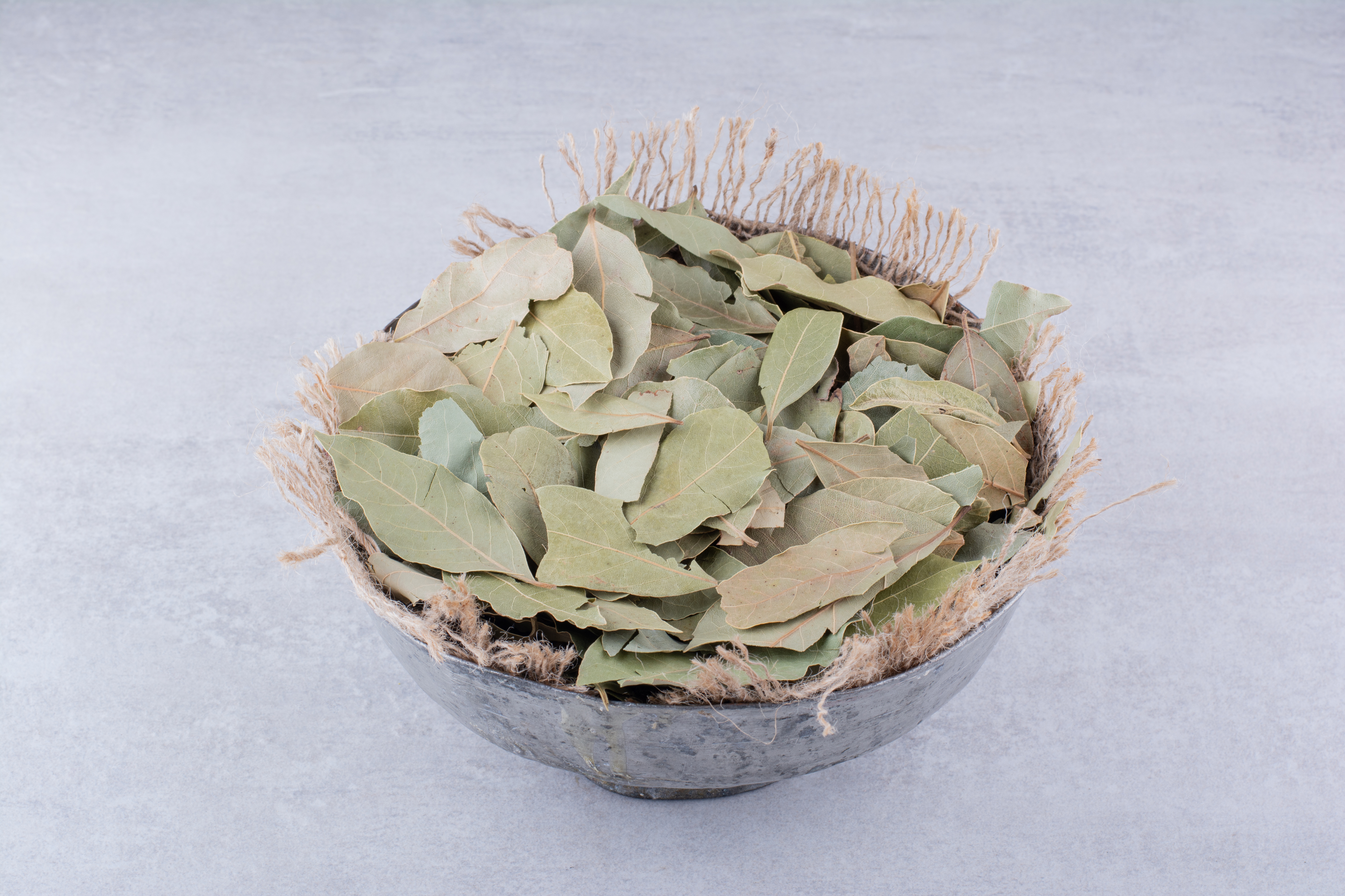 dry-green-bay-leaves-rustic-cup-high-quality-photo