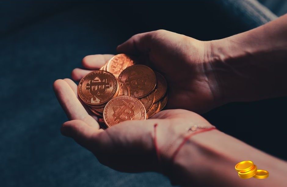 Hand holding golden Bitcoin cryptocurrency coins representing digital investment and passive income opportunities via unsplash