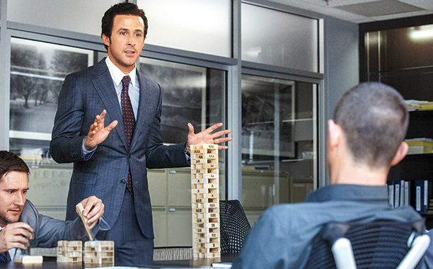 젠가 블록으로 금융 시스템을 설명하는 사진