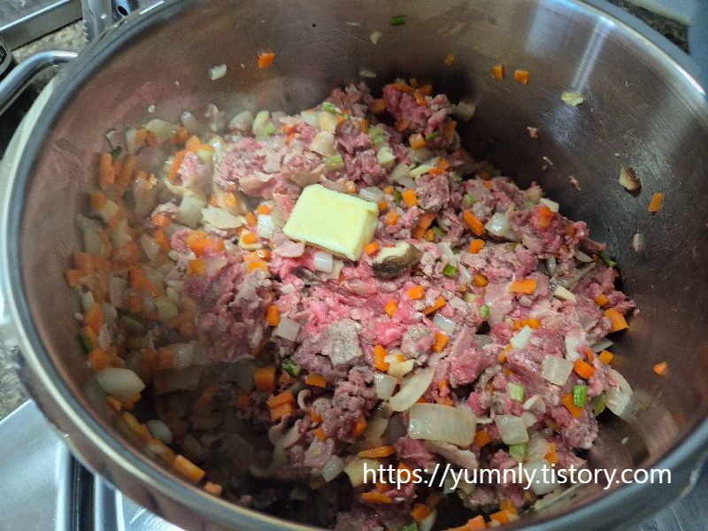 Adding an extra knob of butter to the sautéed vegetables and ground beef mixture