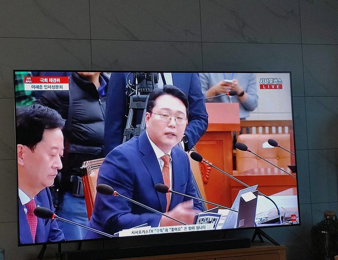 Korean Asian man checking watch before morning workout