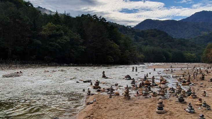 cairns or piled stones by the river