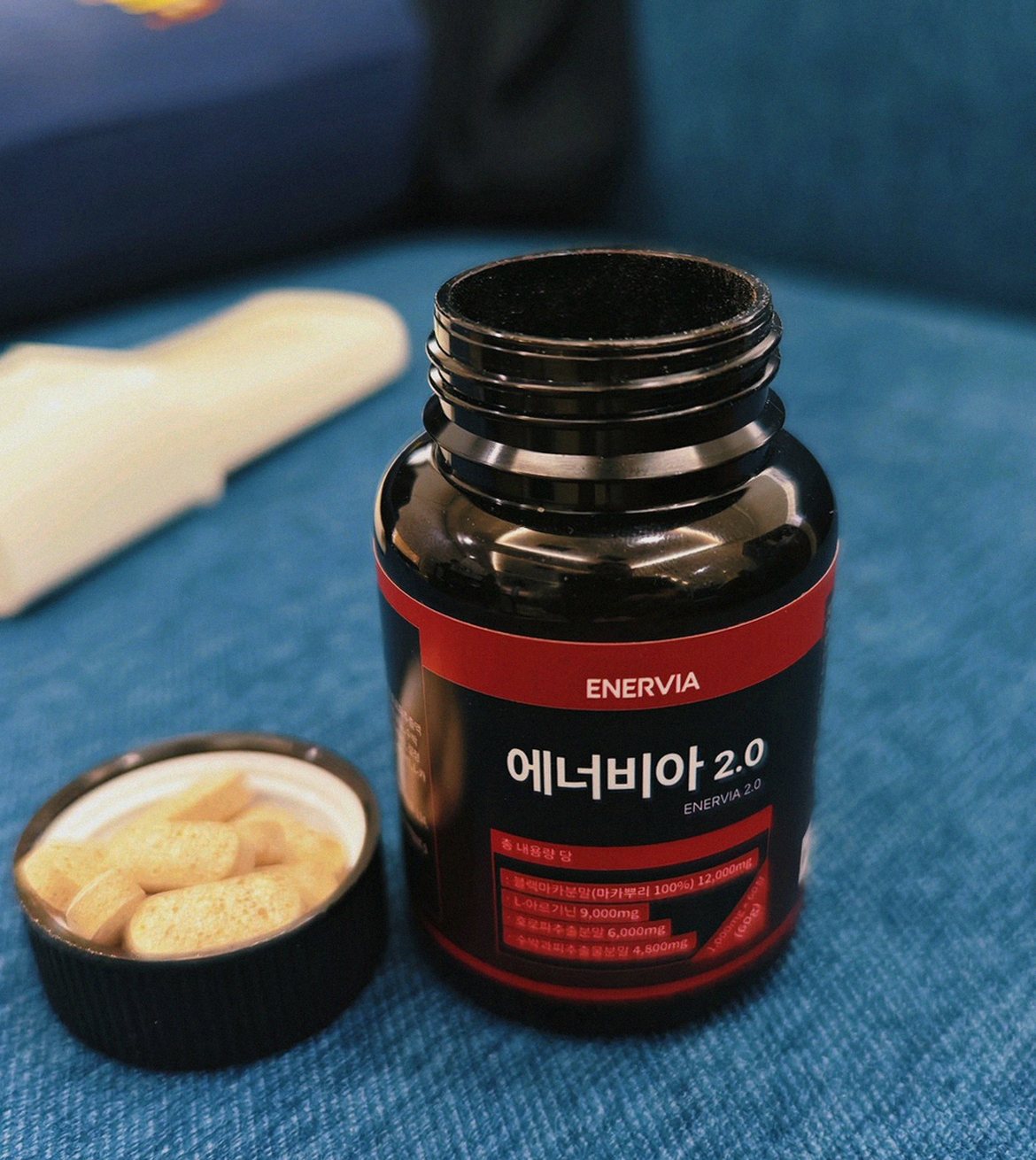 Korean Asian man taking supplement after dinner at dining table