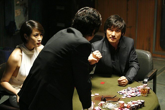 타짜1 영화에서 고니와 아귀가 도박판에서 대치하는 장면