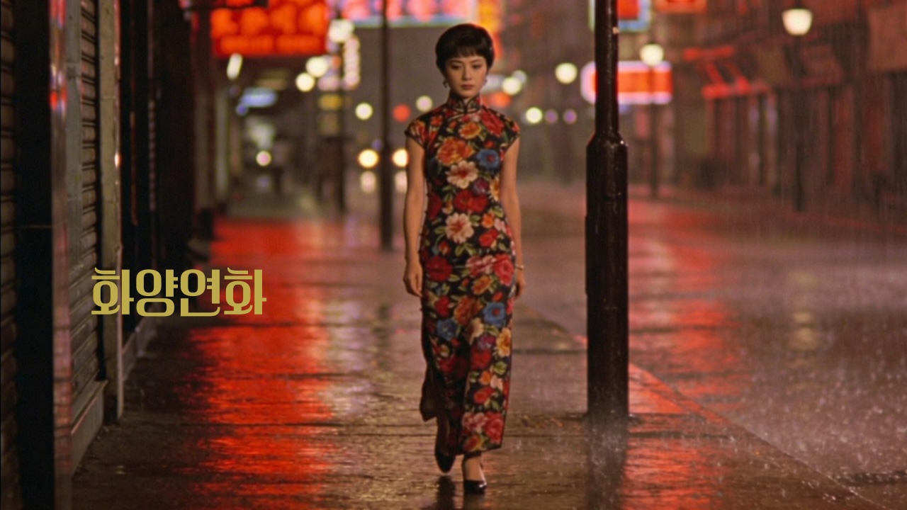 woman walking alone on a rainy Hong Kong street at night