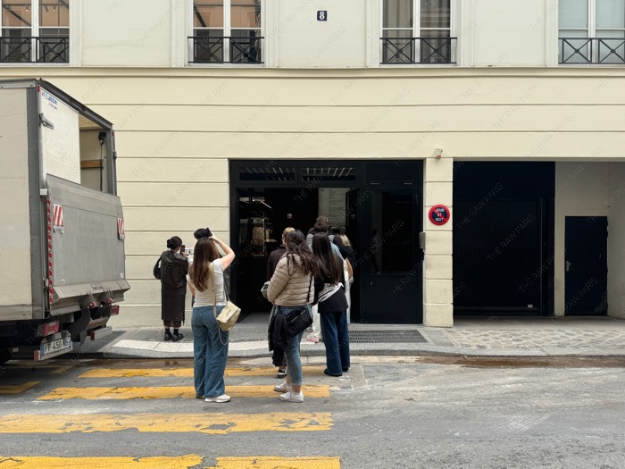 people waiting at saint laurent rive droite cafe paris