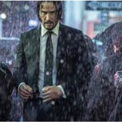 존윅이 비 속을 걷고 있는 모습