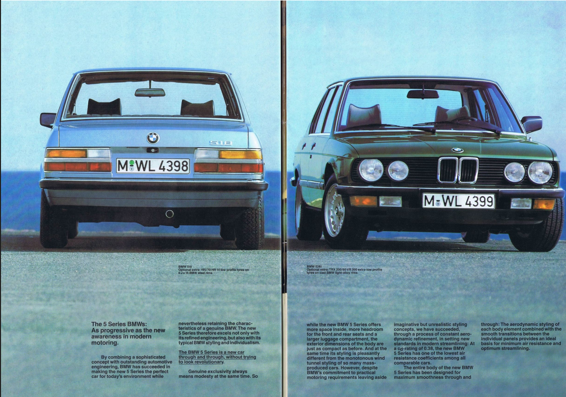 The first generation BMW 5 Series E12 parked in a classic setting, showcasing the original 1972 design.