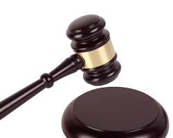 Gavel and sounding block in courtroom