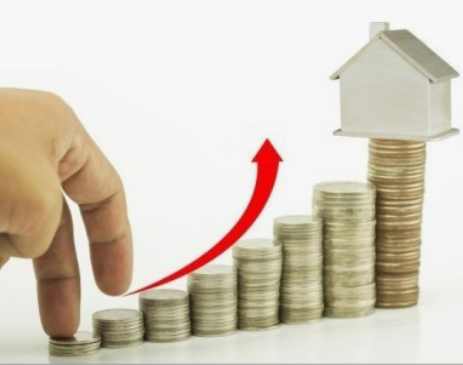 경기 침체 수익 내는 부동산 투자 관련 동전 탑 사진