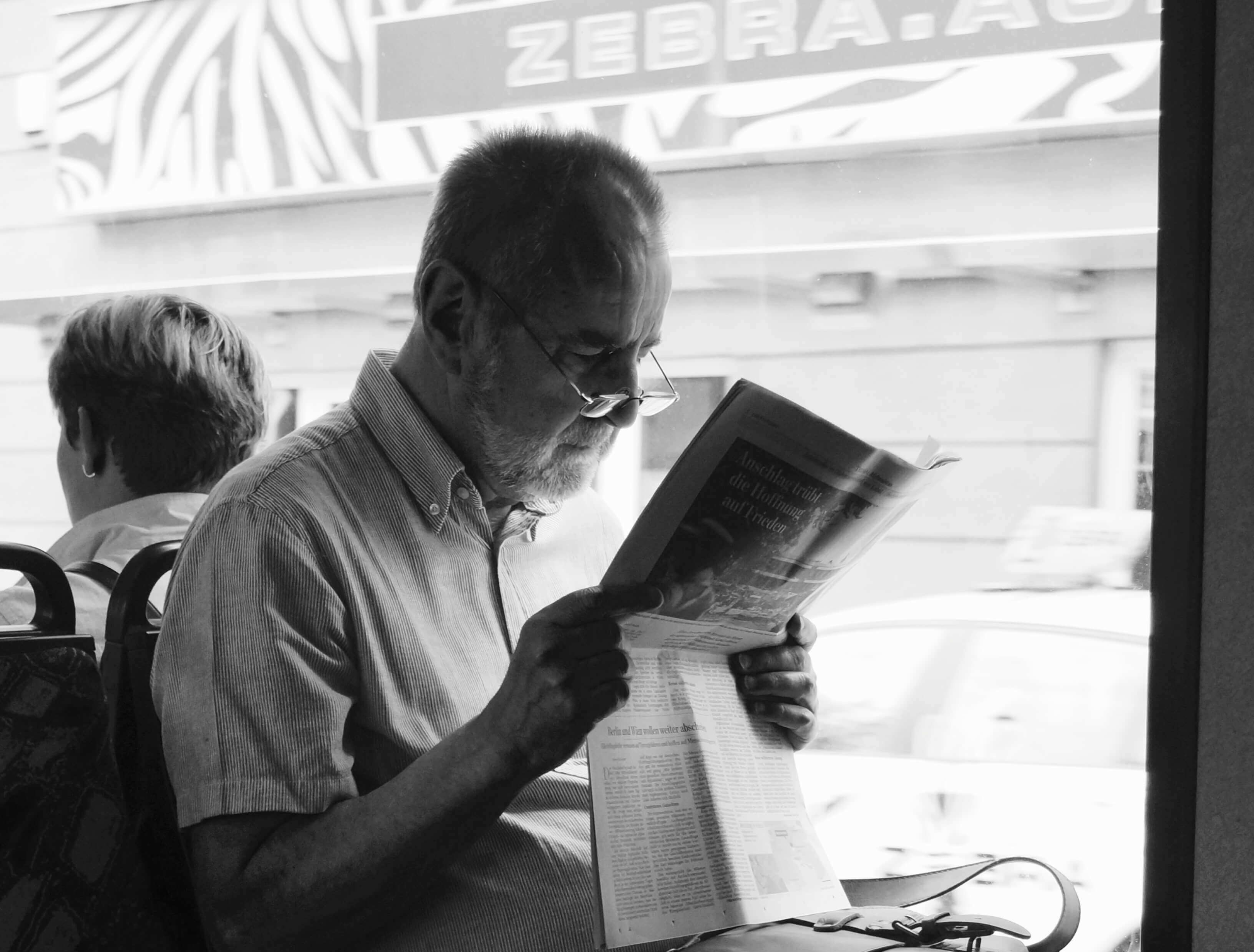 a man reading a newspaper