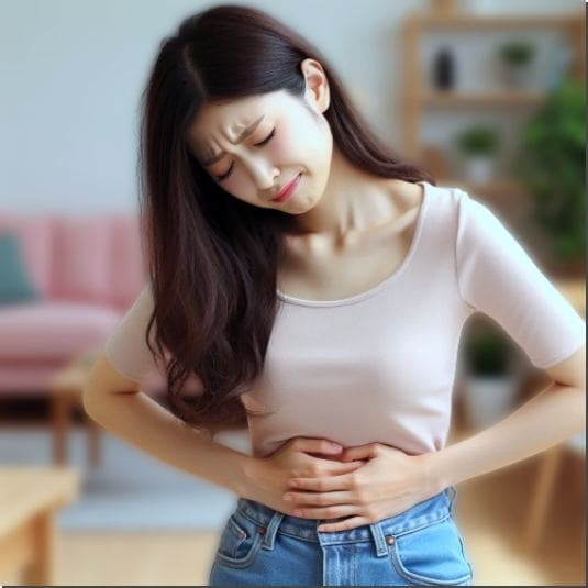 갈락탄 효능 소화기 건강, 배아픈 여성 사진