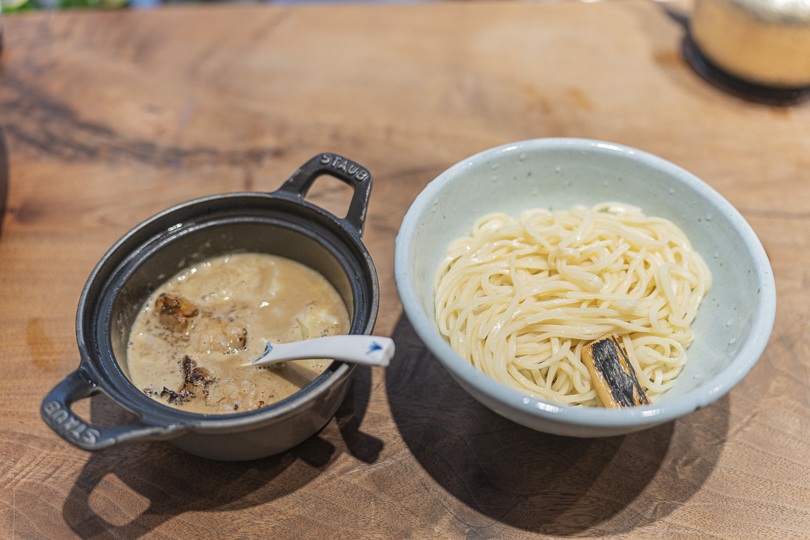 Menya Takakura Nijo: tsukemen with noodles and a small black pot of concentrated broth served separately.