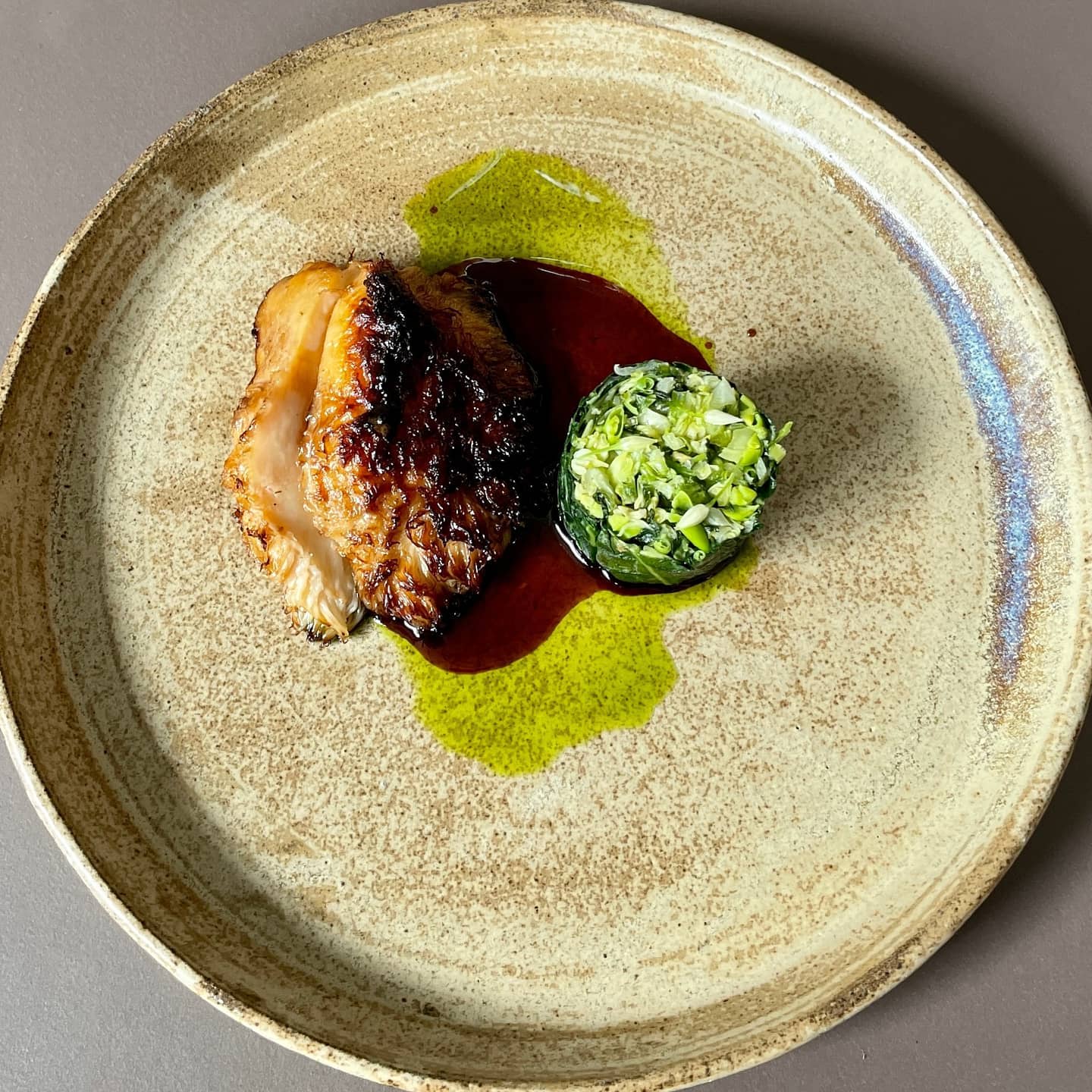 Artfully plated gourmet dish from Ark restaurant in Copenhagen showcasing vegan fine dining with a focus on innovative plant-based ingredients and sauces