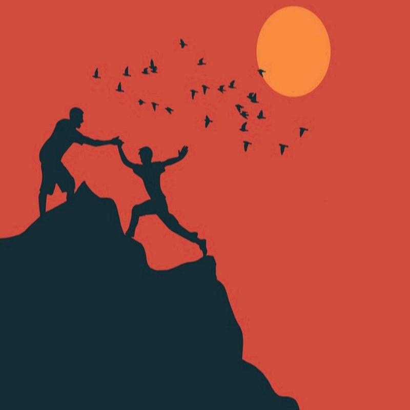 산 정상에서 도움을 주고받는 사람들의 실루엣